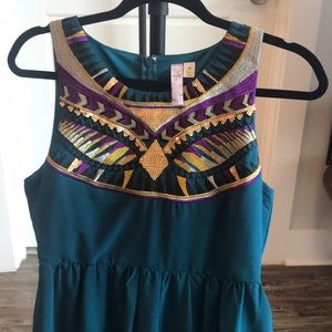 Teal dress with colorful embellishments